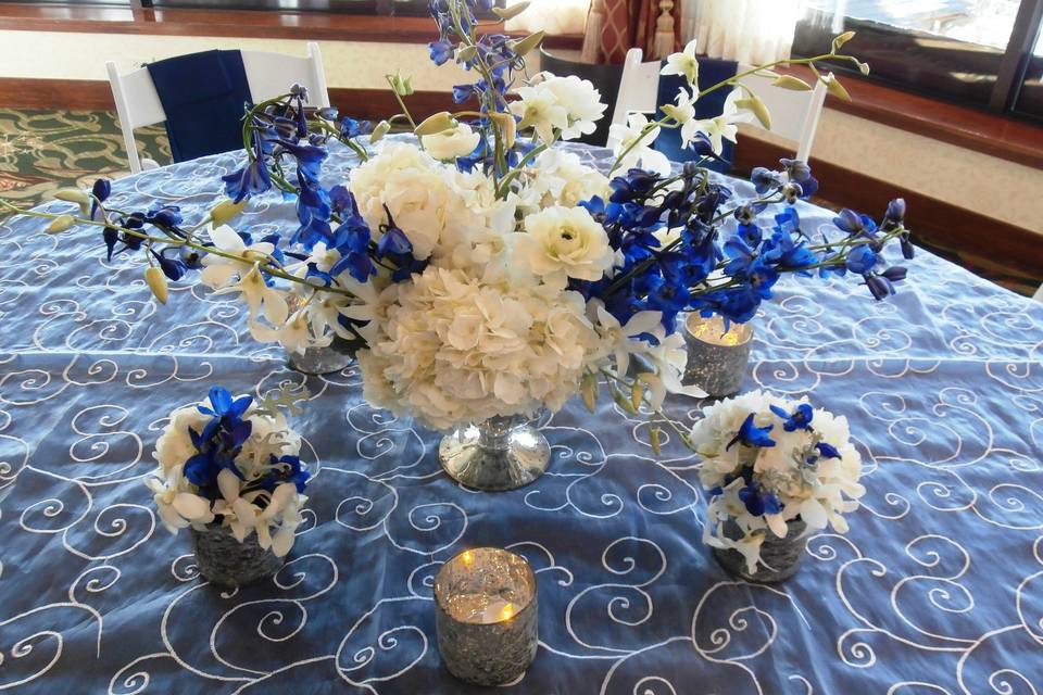 Blue and white mixed flower centerpiece tablescape