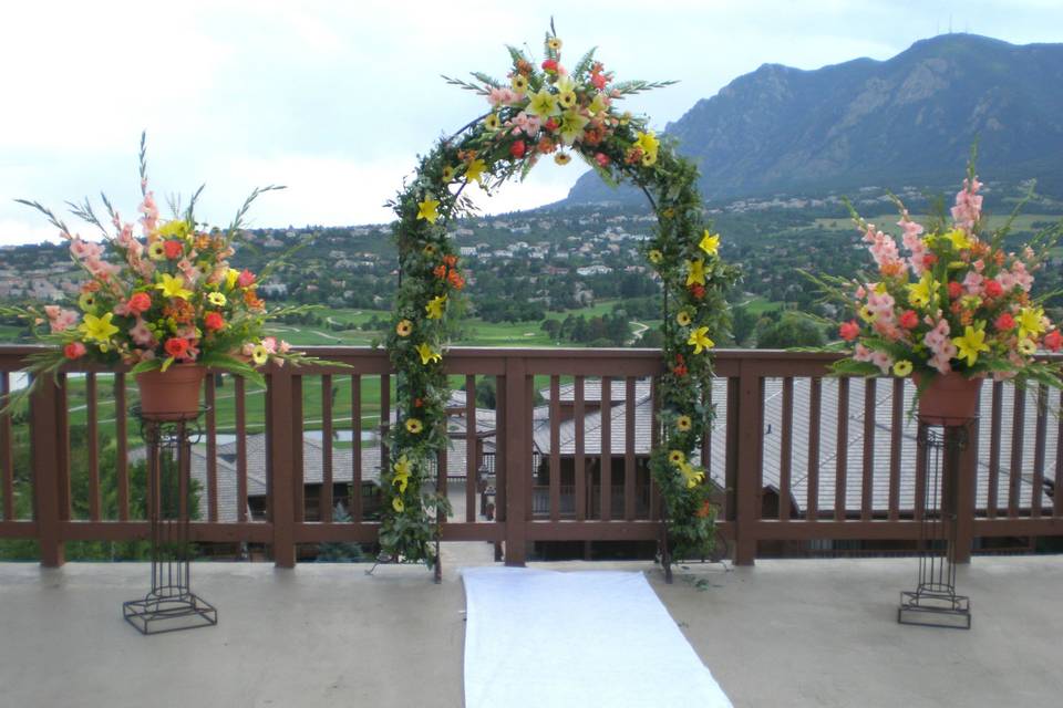 Floral adornment for the arch with display pedestals