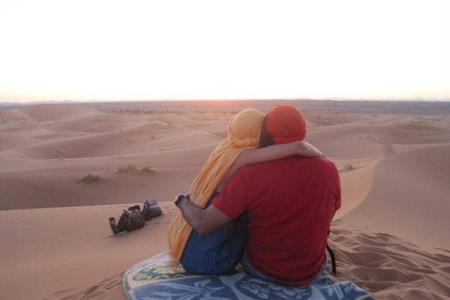 One of my Honeymoon couples enjoying a Morocco desert sunrise.