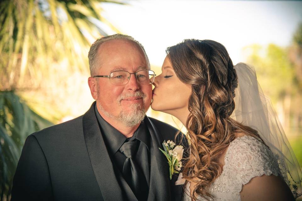 Kissing her father