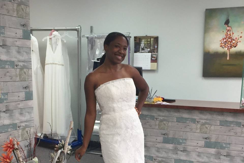 Bride fitting her gown