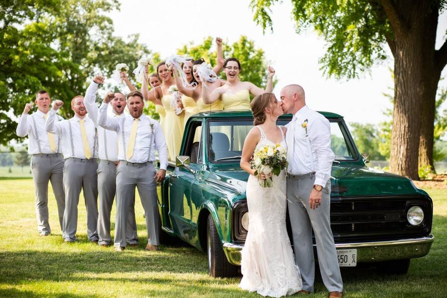 Bridal party by old truck