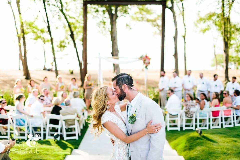 Newlyweds kissing at their ceremony