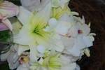 A bouquet of white lilies and orchids.