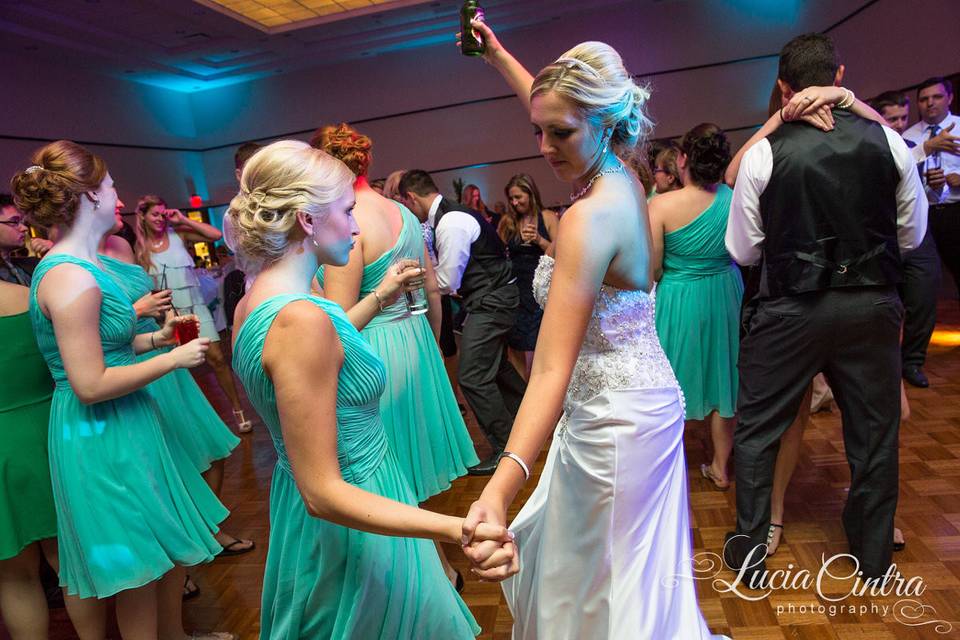 Bride and bridesmaids dancing