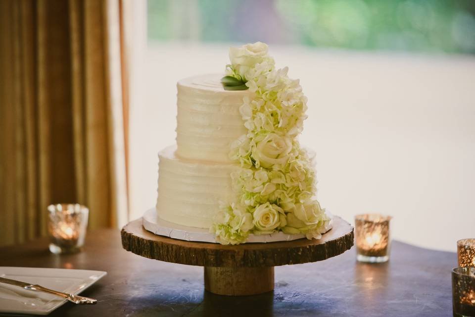 Two tier cake with cascading white flowers