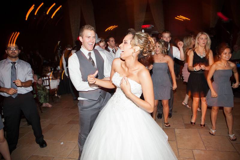 Couple dancing with guests