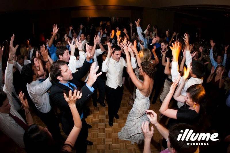 Couple with the guests dancing