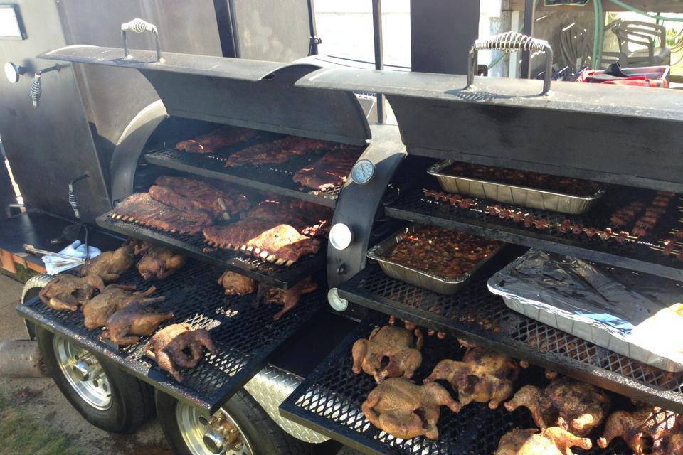Our 22 foot BBQ Pit can cook 900 lbs. of meat at a time.