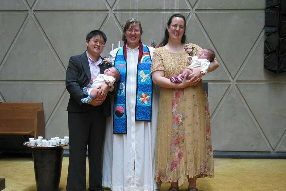 Officiant with the newlywed couple