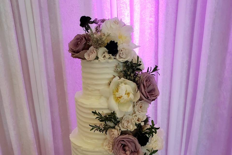 Four tier with purple flowers