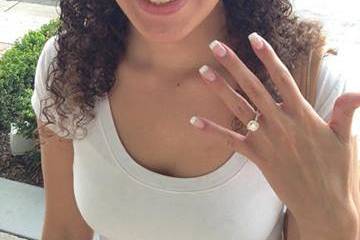 A happy customer showing off her ring exclusively designed by Global Rings!!
