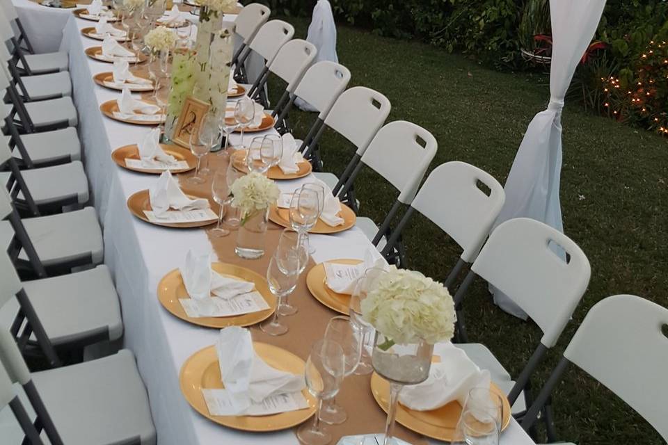 Unique table scape under a globe lighted canopy