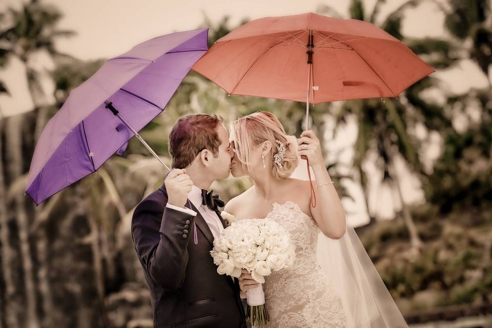 Kissing beneath umbrellas