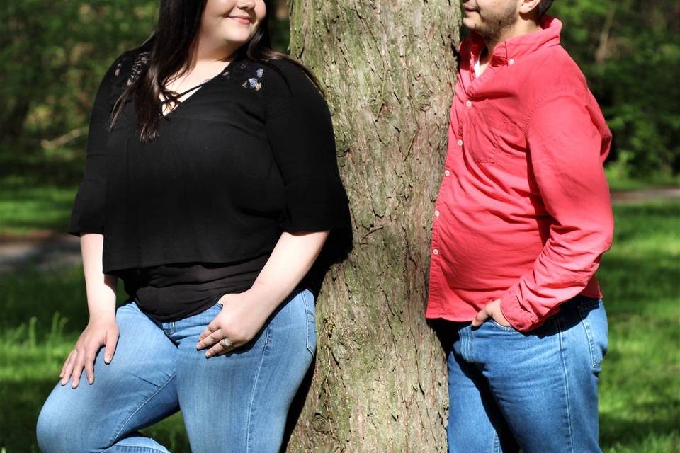 Couple posing by tree