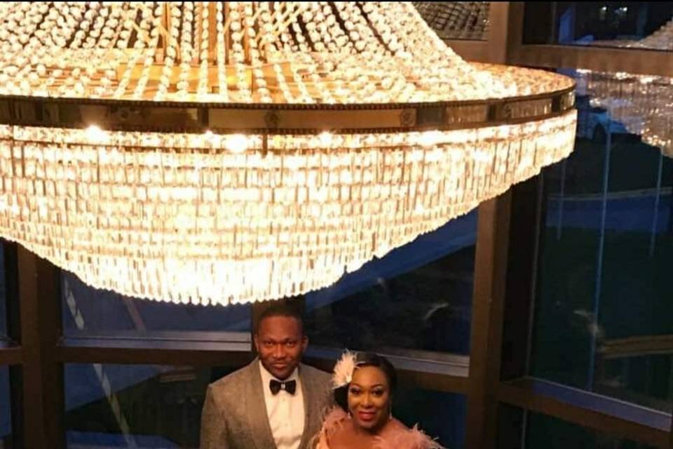 Looking glamorous under the chandelier