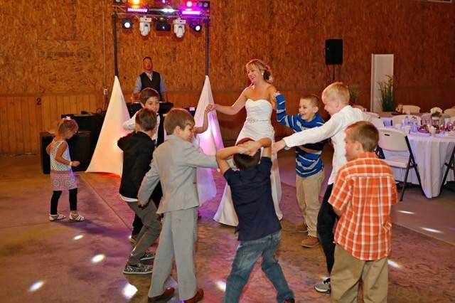 Children dancing with guest-of-honor