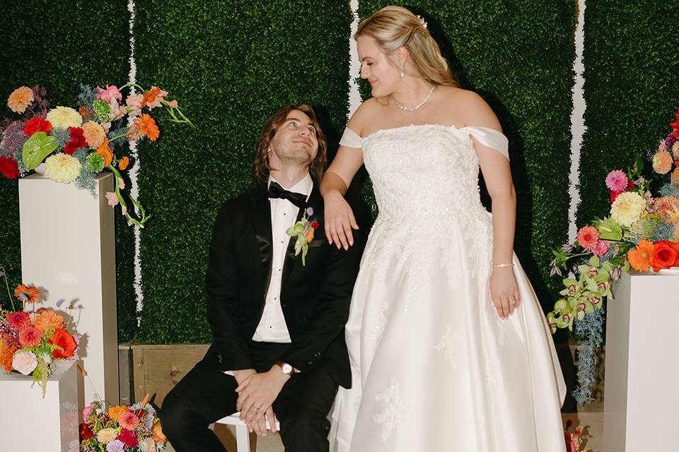 Couple with ceremony backdrop