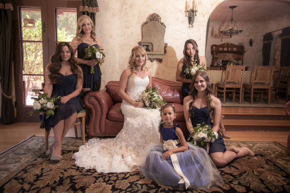 The bride with the bridesmaids and flower girl