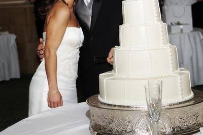 Bride and Groom shown at cake table