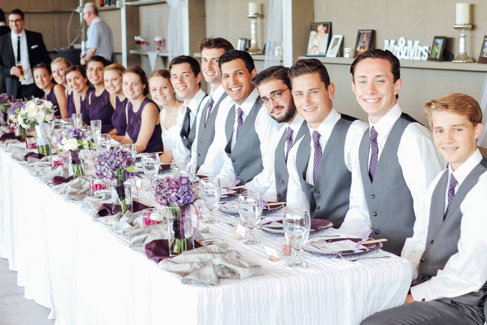 Long table for the newlyweds and their bridesmaids and groomsmen