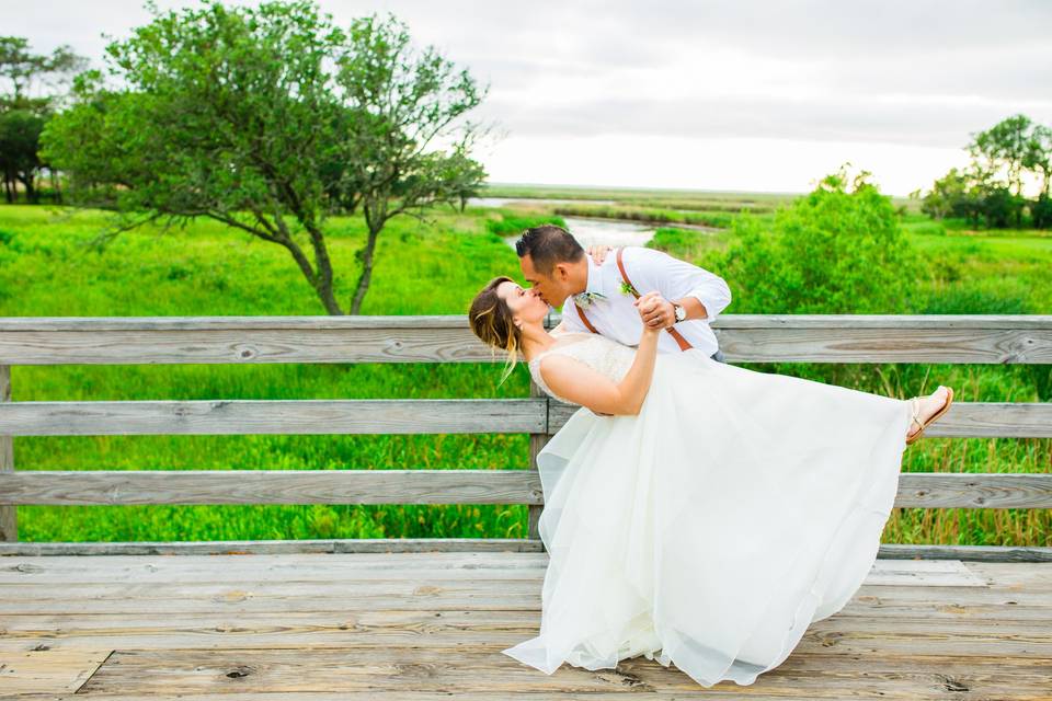 The Black Stallion | OBX WeddingPhotography: Maite PhotographyCoordination: The Proper SettingDecor: Bells & WhistlesMusic: DJ BruceCaterer: Ocean BoulevardDessert: Just DessertsRentals: Ocean Atlantic Rentals, I Do OBX ChairsHair & Makeup: Lovies Salon & Spa