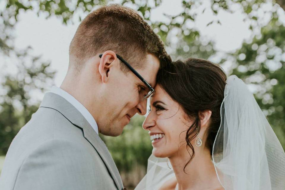 Bride and groom holding each other