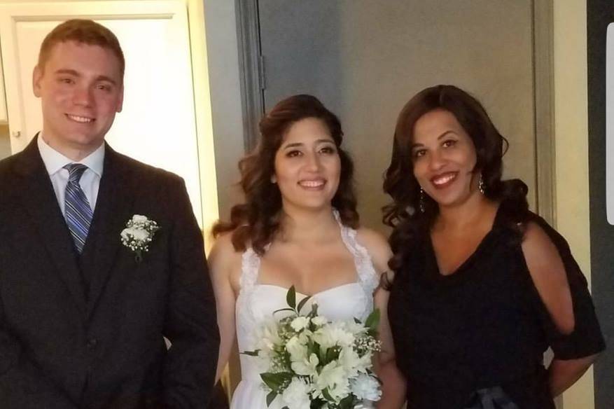 Bride and groom with the officiant