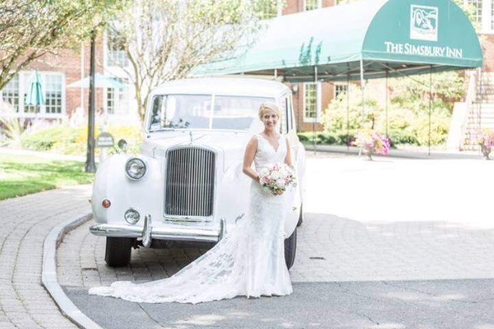 Bride photo beside the  getaway car