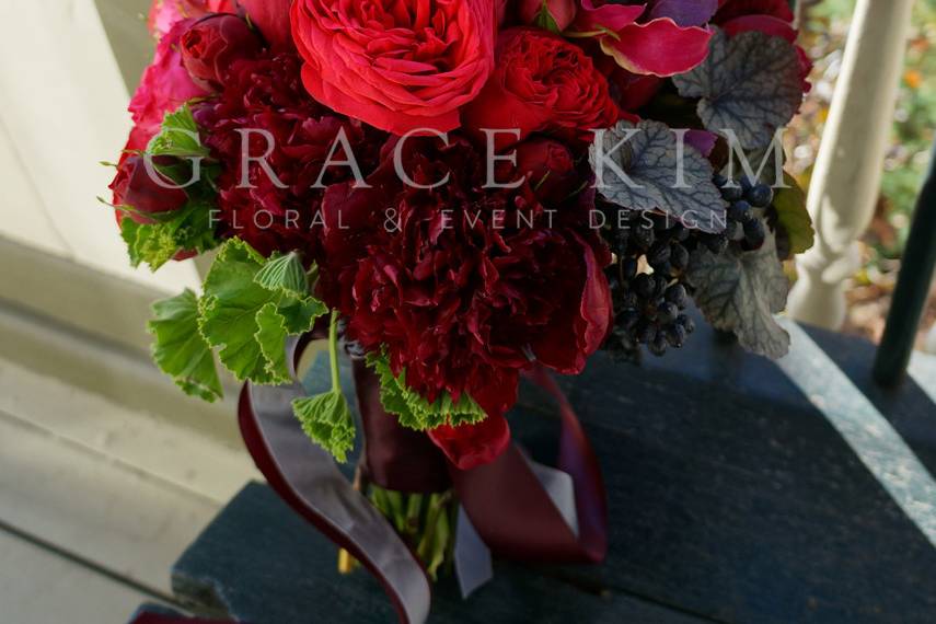 Grace Kim Floral & Event Design- burgundy bridal bouquet: peonies, garden roses, gloriosa lillies, privet berries, geranium, silver and burgundy ribbon