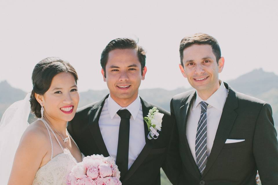 Officiant with the newlyweds