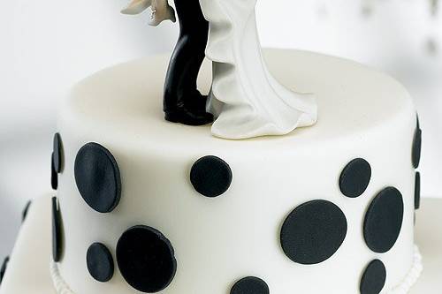 Kissing Wedding Couple Cake Topper- WS8446...Add a little fun with your romance, this couple shares their wedding kiss on top of the cake.