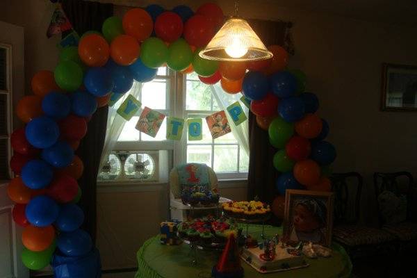 My sons 1st Birthday Party. Cupcakes, decorations and balloon arch prepared by me.  Just some ideas for an intimate at home aprty