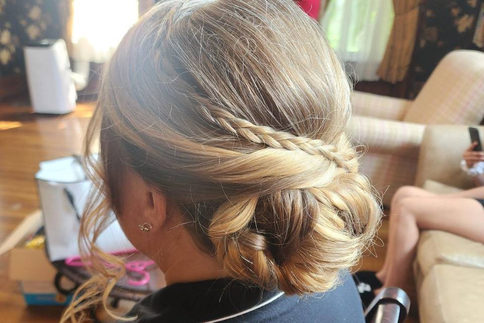 Low bun with tiny braid