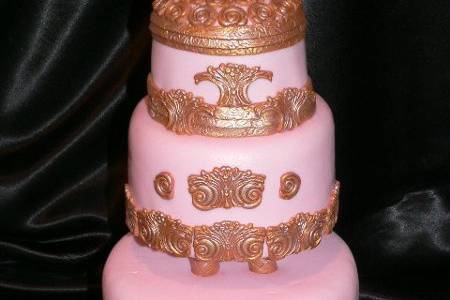 Baby pink with gold architectual accents.
