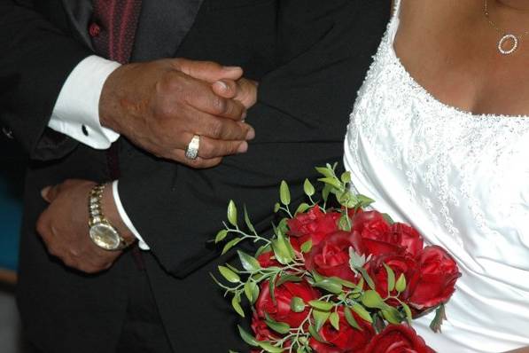 The silk red roses were hand picked by the bride. The centerpeieces were beautiful red silk roses that matched the brides.