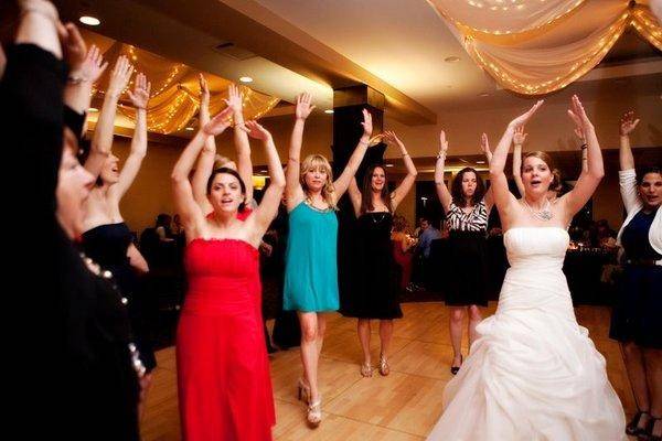The bride with her bridesmaid dancing