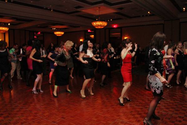 The bride with her bridesmaid dancing