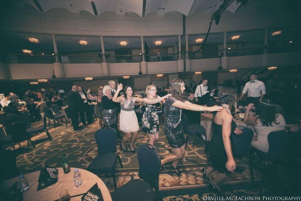 The bride with her bridesmaid dancing