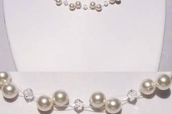 A popular and affordable selection for both brides and bridesmaids. This necklace features Swarovski pearls and crystals that appear to float on illusion cord.
