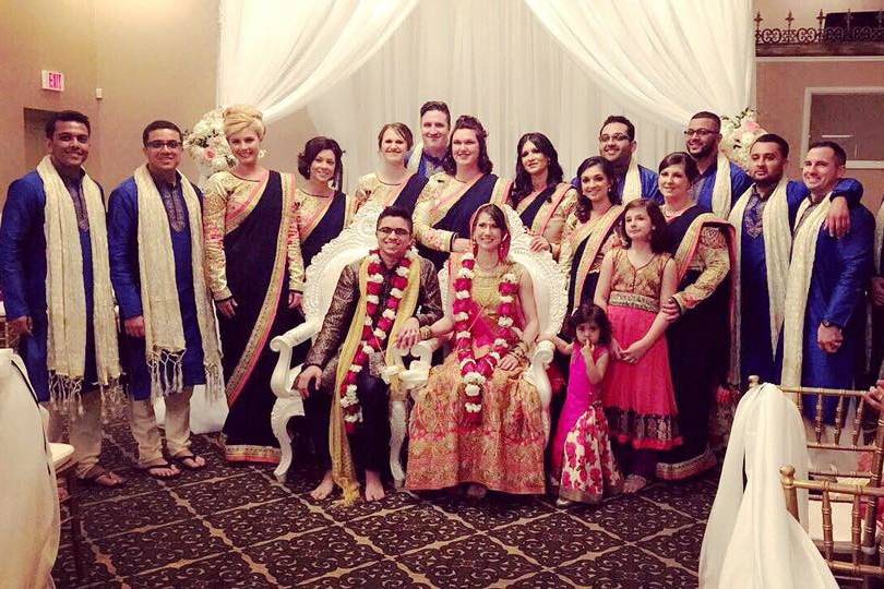 The couple with the bridesmaids and groomsmen