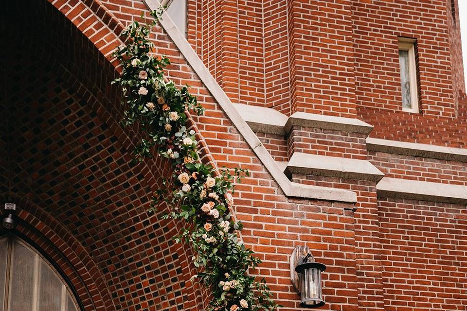 Flower garland entering church