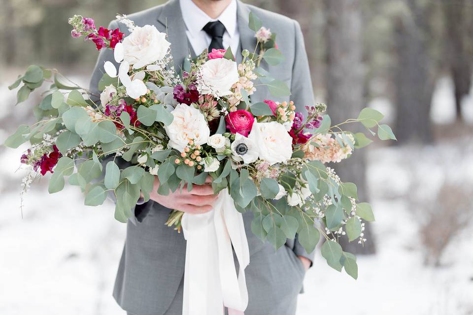 Bridal bouquet held by the gro