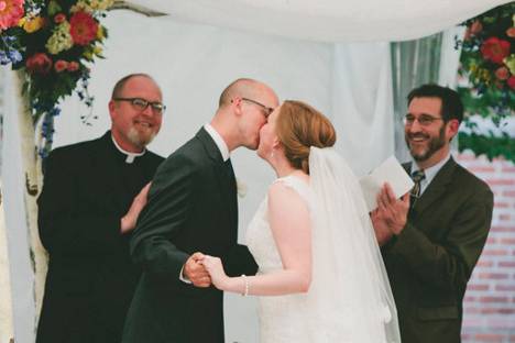 The bride and groom celebrate at the end of a beautiful ceremony