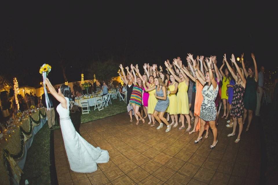 Bride throwing her bouquet