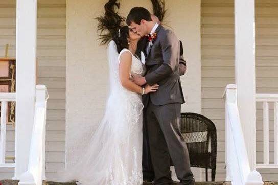 Couple kiss at the porch