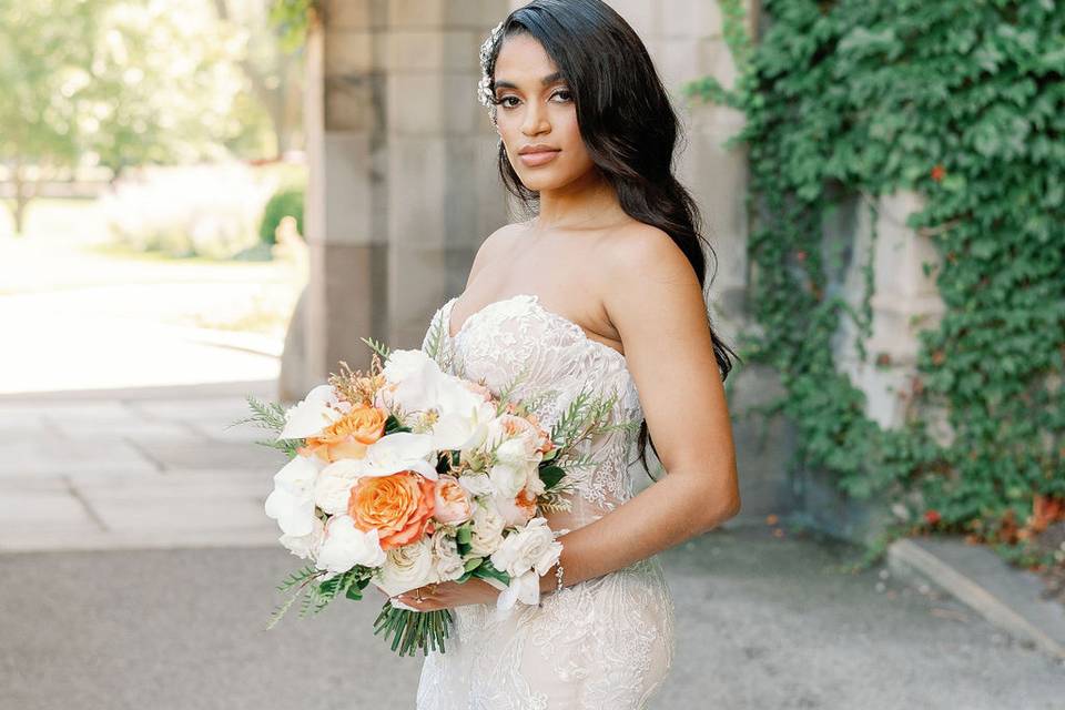 Bride posing with wedding bouquet