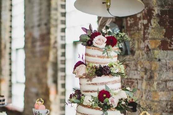 Topsy Turvy Floral Wedding CakePhoto by Aimee Jobe Photography