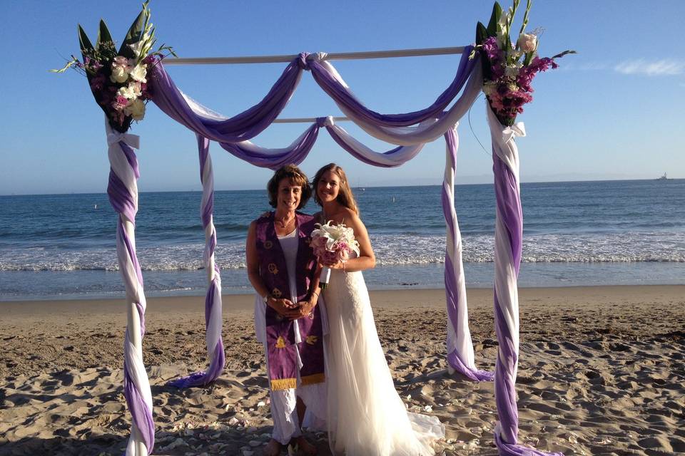 Reverend and bride at the beach ceremony