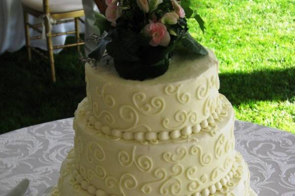 Four tier cake with embellishments